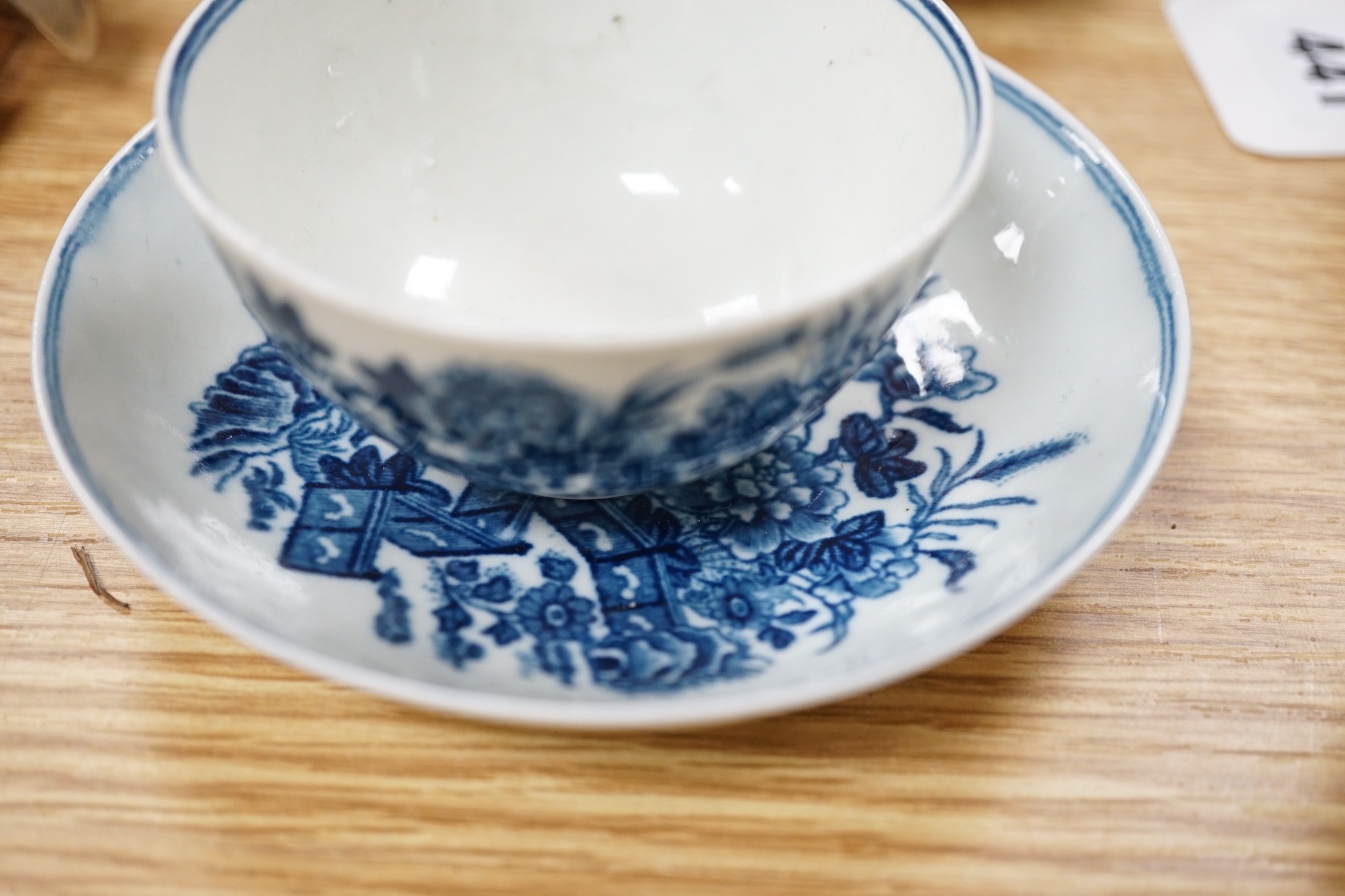 A Worcester teabowl and saucer printed with the Bat pattern, a coffee cup and saucer with the Argument pattern, another with the Fence pattern and a similar bowl and a very interesting pearlware bowl